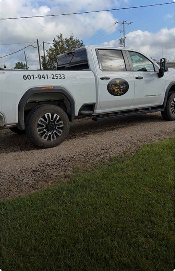 White pickup truck with business logo